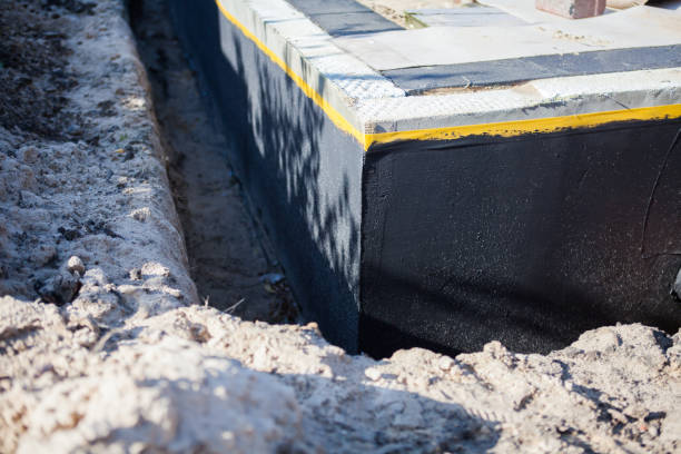 Professional Waterproofing technician working in Iberia, OH